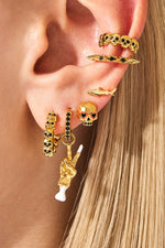 Woman wearing gold earrings