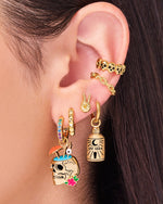 Woman wearing gold earrings