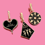 Three gold charms on a pink background - Takes you to Coven Charm